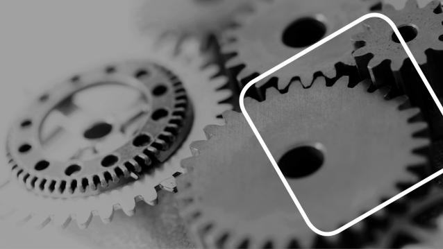 Das Bild zeigt Zahnräder in grau