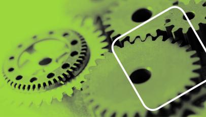 Das Bild zeigt Zahnräder in grün